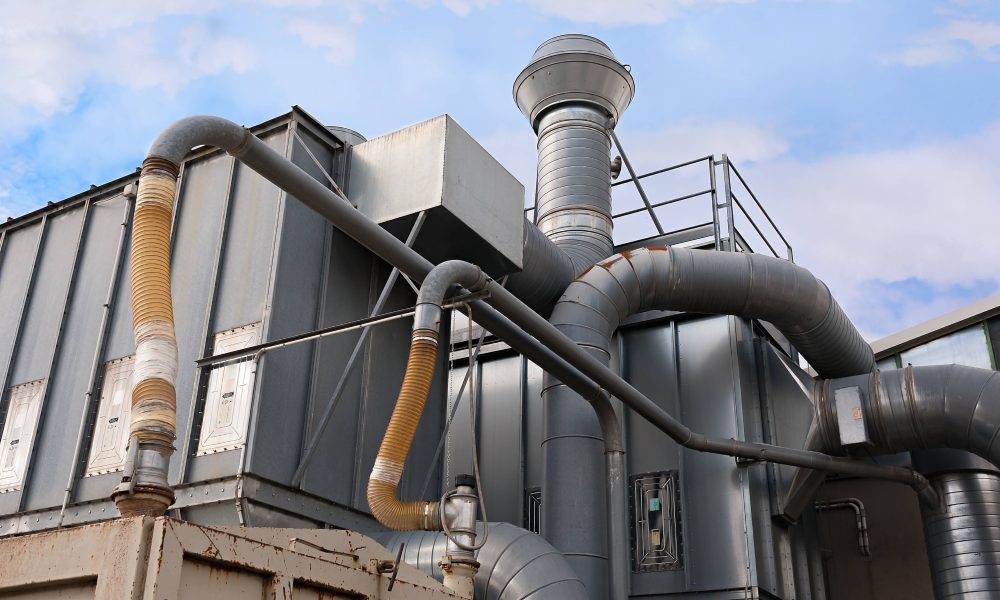 Industrial factory air filtration system. Industrial factory air filtration system. Tubes, tank and chimney.